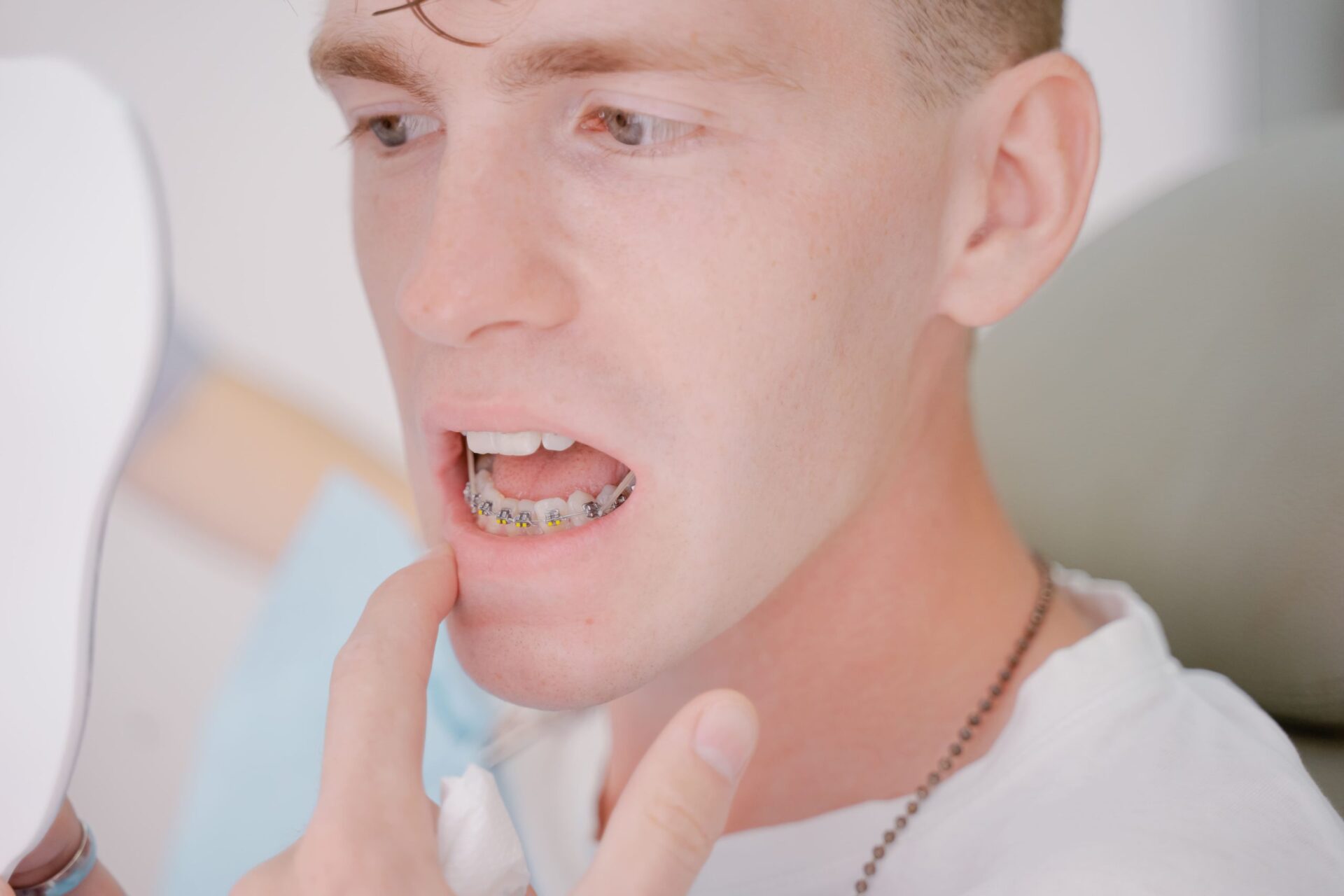 the guy looks in the mirror at the installed brace utc