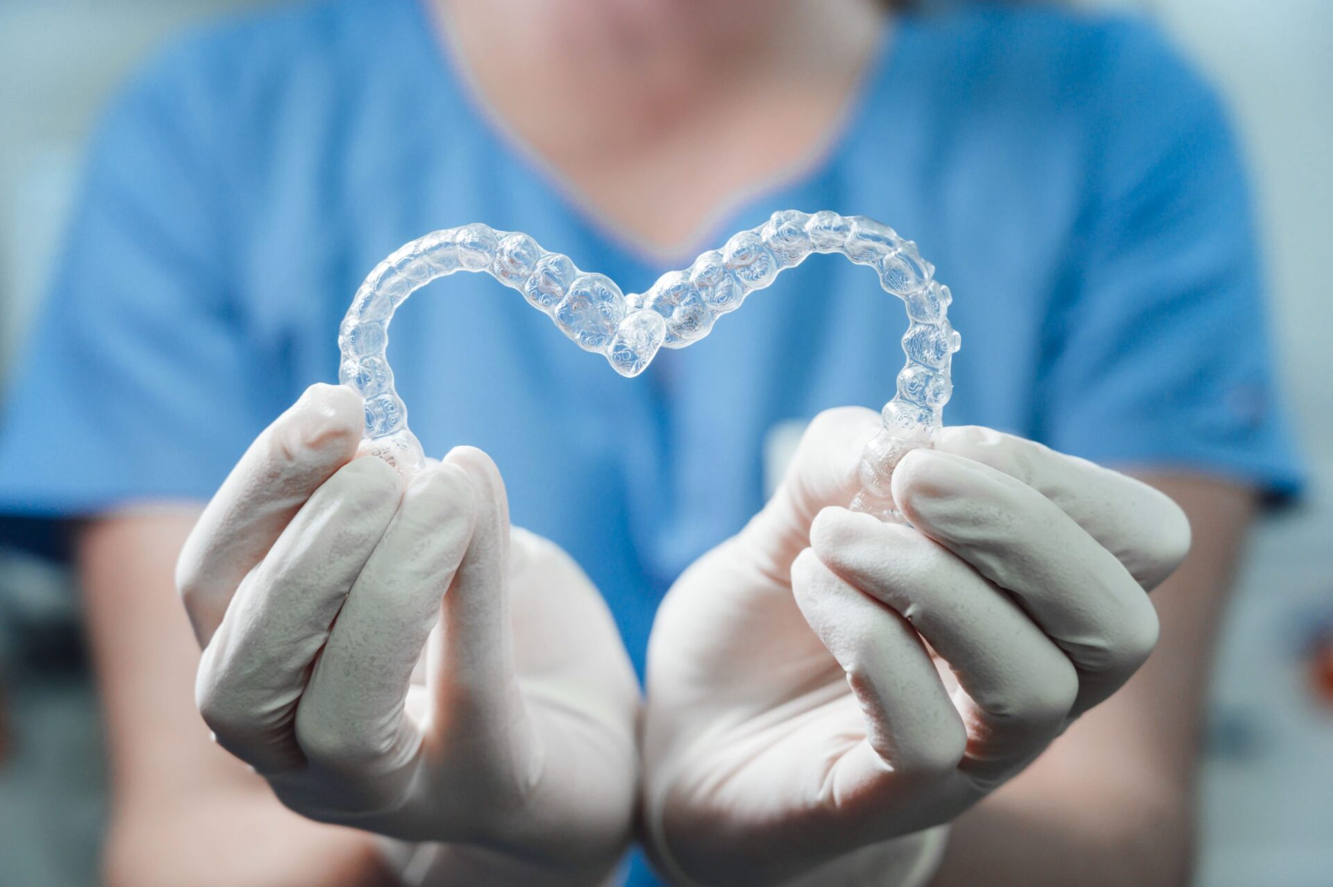 female doctor holding two transparent heart shaped utc