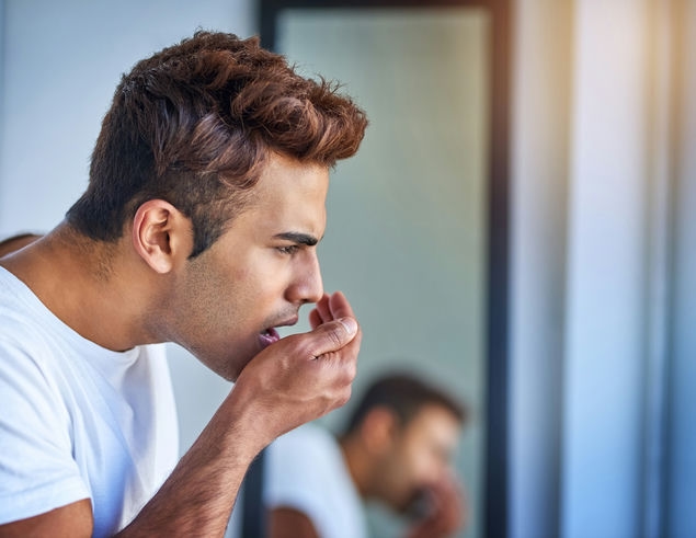 shot of a handsome young man smelling his breath d 2022 10 10 23 46 35 utc c